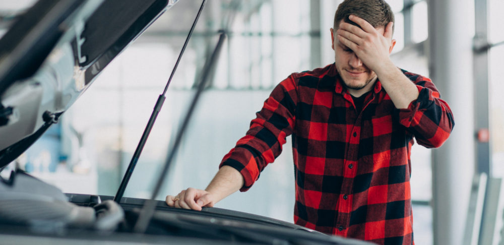 young-man-making-diagnostics-vehicle